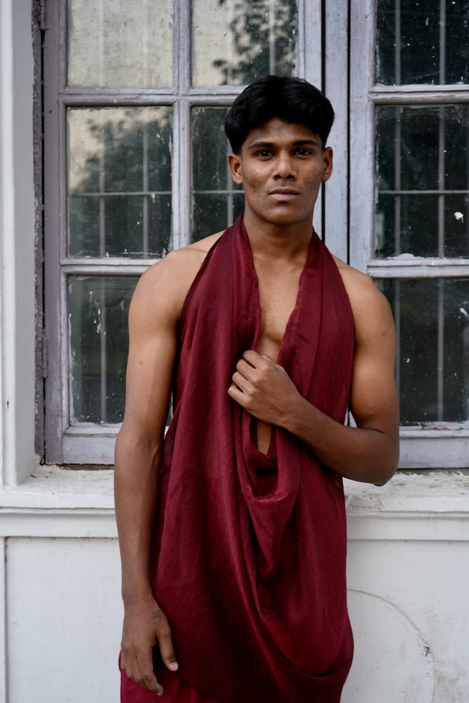 Close-up — draped crimson fabric detail